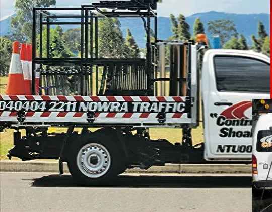 A Nowra Traffic tray ute loaded with its sign cage and cones